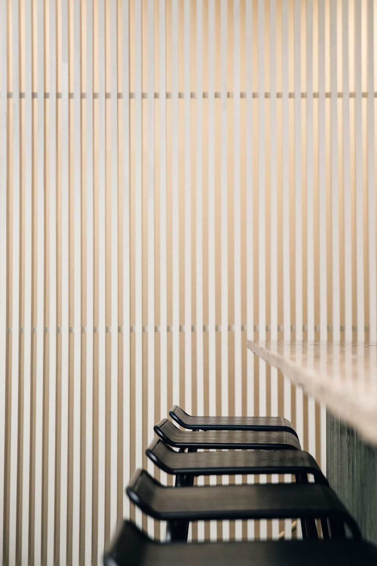 vertical striped wall behind bar